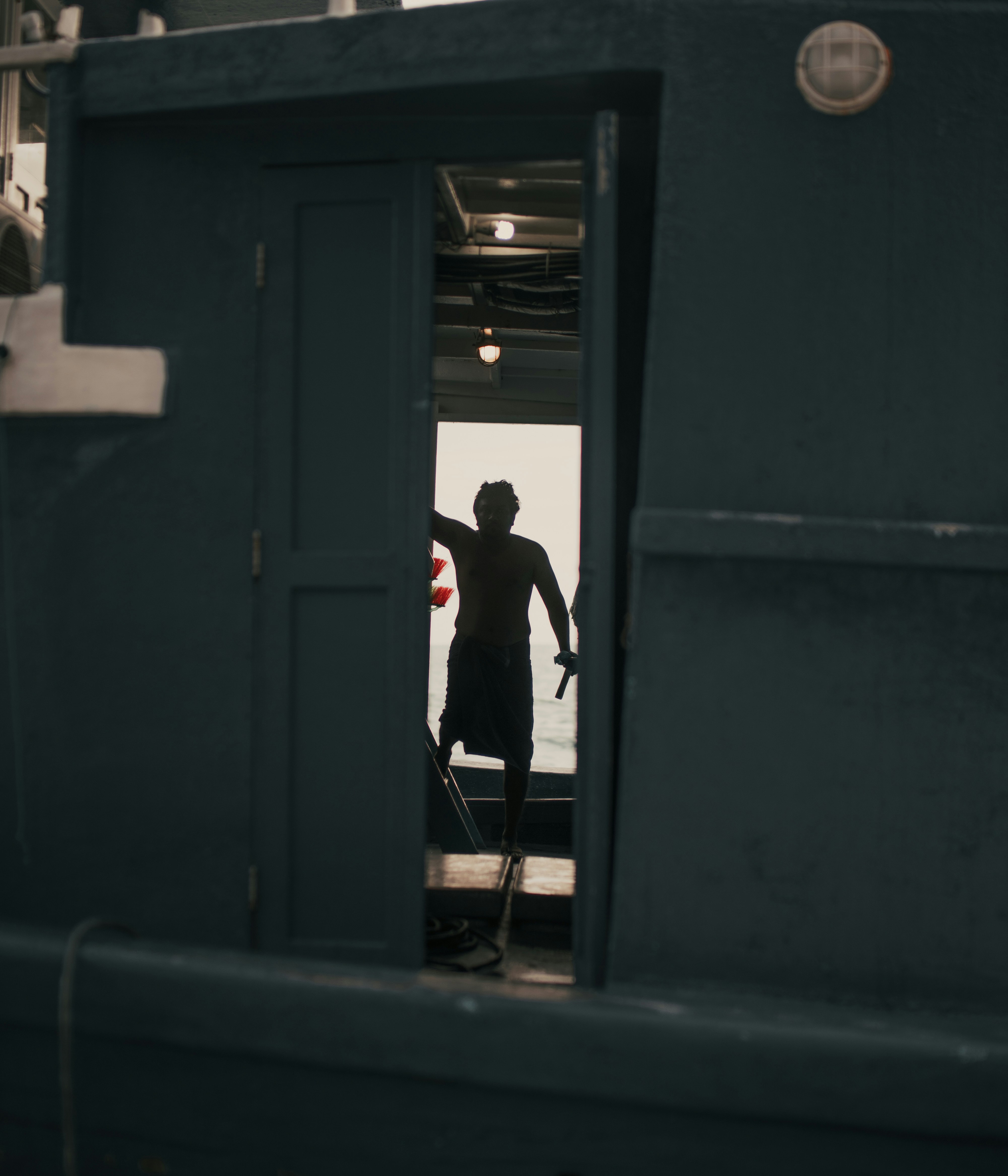 a man standing on a boat in the water